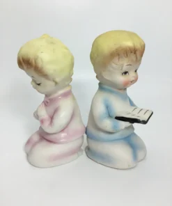 Vintage ceramic salt and pepper shakers with praying children in pastel clothing 12