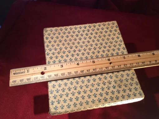 Box with ruler measurement of rare antique dragon knives set, top view