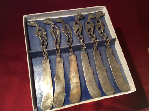 Open box view – set of six antique butter knives with ornate dragon handles