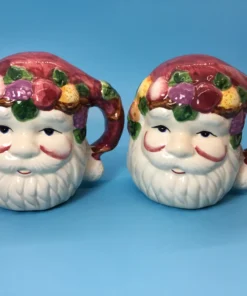Pair of vintage Santa Claus salt and pepper shakers with fruit-laden hats