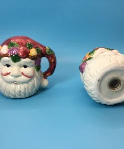 Vintage ceramic Santa salt shaker showing bottom opening