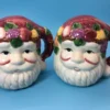 Front close-up of hand-painted Santa Claus face shakers with holiday fruit details