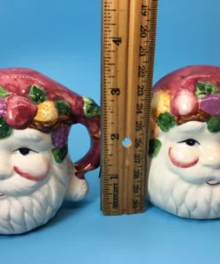 size of shakers. Back view of Santa shakers with maroon hats shaped like handles