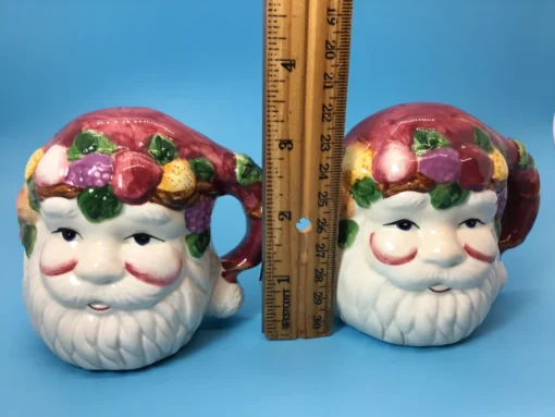 size of shakers. Back view of Santa shakers with maroon hats shaped like handles