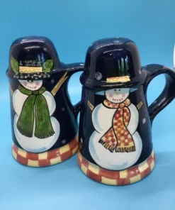 A festive duo of vintage snowmen salt and pepper shakers, ready to add cheer to your holiday table or winter decor display. 1