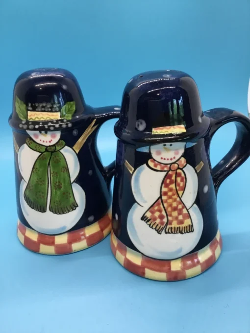 A festive duo of vintage snowmen salt and pepper shakers, ready to add cheer to your holiday table or winter decor display. 1