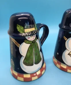 A festive duo of vintage snowmen salt and pepper shakers, ready to add cheer to your holiday table or winter decor display. 2