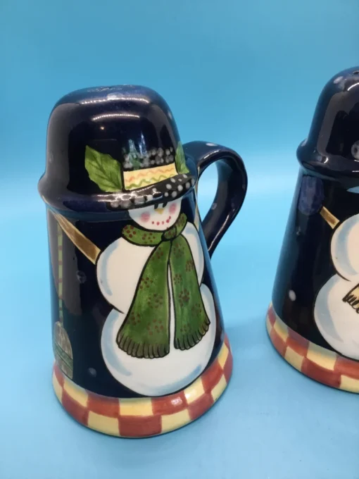 A festive duo of vintage snowmen salt and pepper shakers, ready to add cheer to your holiday table or winter decor display. 2
