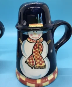 A festive duo of vintage snowmen salt and pepper shakers, ready to add cheer to your holiday table or winter decor display. 4