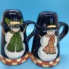 A festive duo of vintage snowmen salt and pepper shakers, ready to add cheer to your holiday table or winter decor display. 5