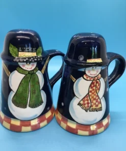 A festive duo of vintage snowmen salt and pepper shakers, ready to add cheer to your holiday table or winter decor display. 5