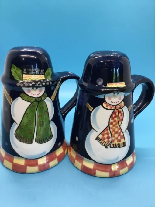 A festive duo of vintage snowmen salt and pepper shakers, ready to add cheer to your holiday table or winter decor display. 5
