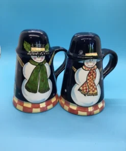 A festive duo of vintage snowmen salt and pepper shakers, ready to add cheer to your holiday table or winter decor display. 6