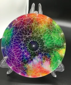 Tilted view of colorful charger plate reflecting white light in studio setting