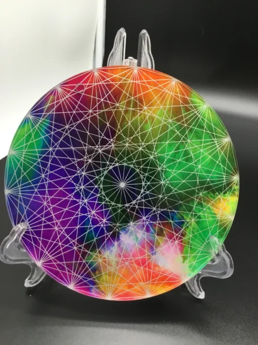 Tilted view of colorful charger plate reflecting white light in studio setting