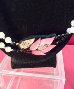 Angled shot of lotus inlay with bead strands