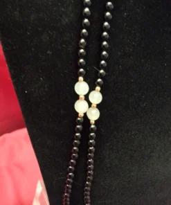 Focused shot of bead strands with gold spacers