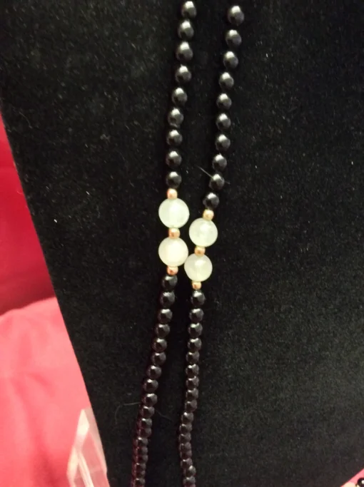 Focused shot of bead strands with gold spacers