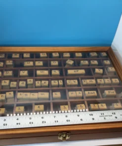 Ruler measuring vintage rubber stamp set inside wooden case