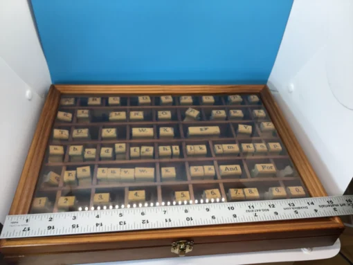 Ruler measuring vintage rubber stamp set inside wooden case
