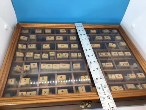 uler measuring vintage rubber stamp set vertically inside wooden case