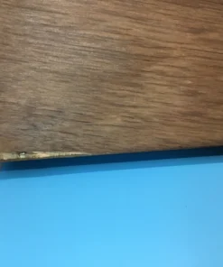 Close-up of sawtooth hanger on the back of the rubber stamp case