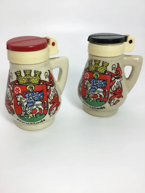 Pair of vintage German salt and pepper shakers with Neustadt crest