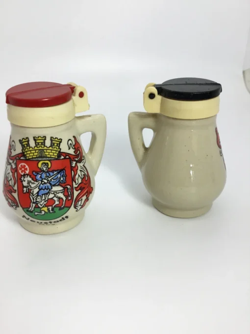Front and back view of vintage Neustadt stein-style salt shakers