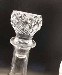 Detailed close-up of diamond-pattern crystal-style decanter stopper