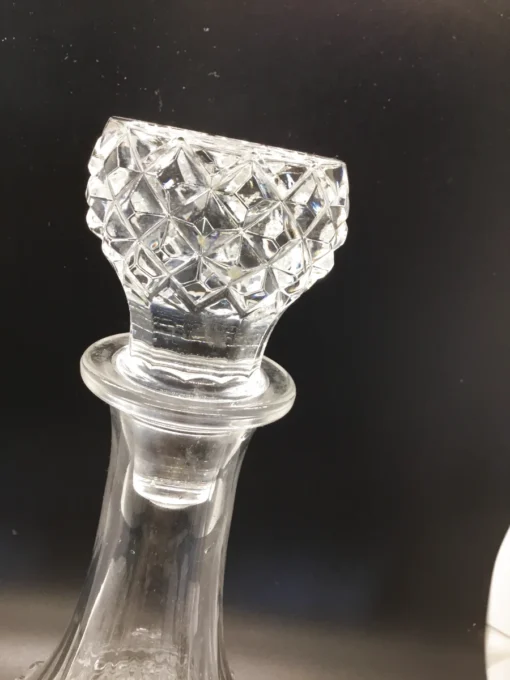 Detailed close-up of diamond-pattern crystal-style decanter stopper